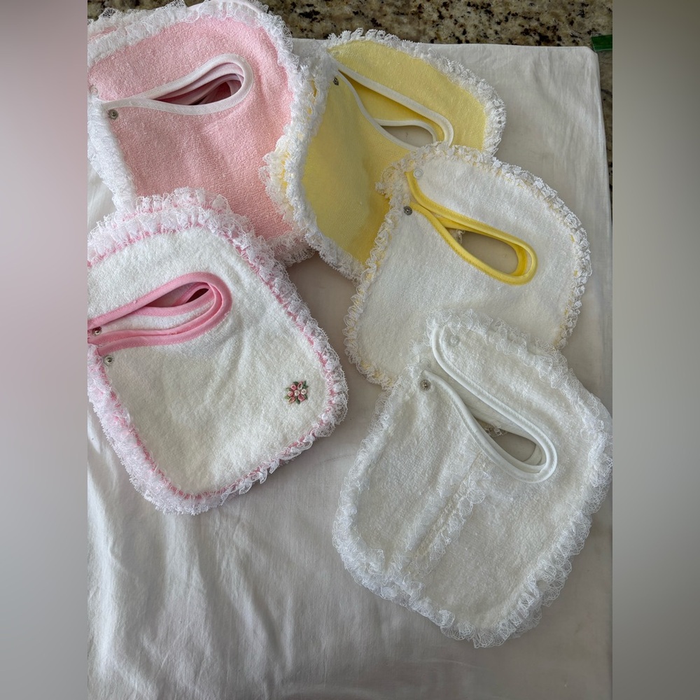 Set a 4 brand new baby girl bibs. Newborn cotton Terri cloth made in the USA NEW